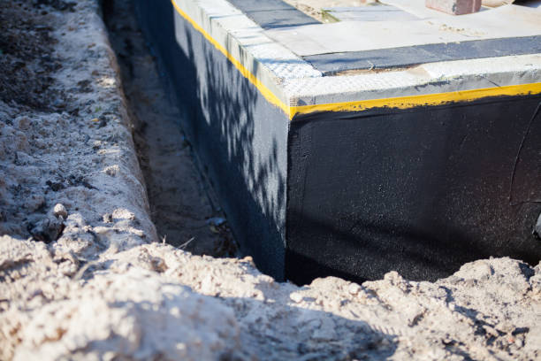 Professional Basement Waterproofing technician working in Brentwood, MD
